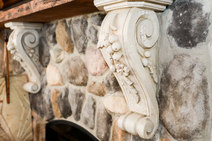 intricately designed fireplace mantel and surround